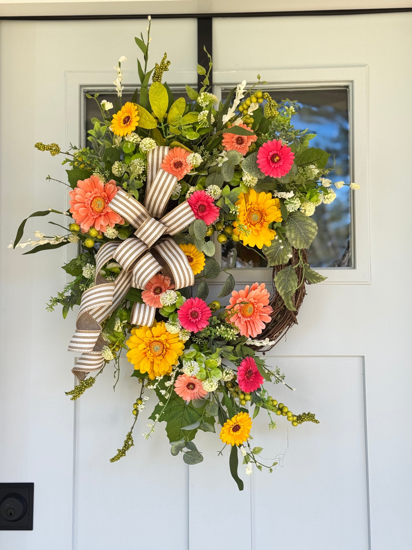 Vibrant Floral Wreath with Striped Bow
