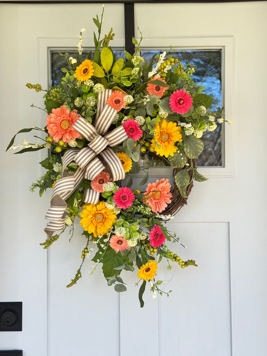 Vibrant Floral Wreath with Striped Bow